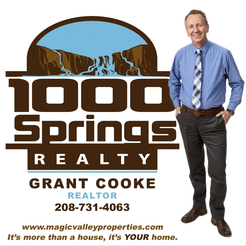 grant cooke standing with logo